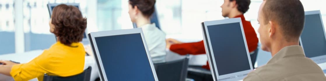 Employees using computers in an office