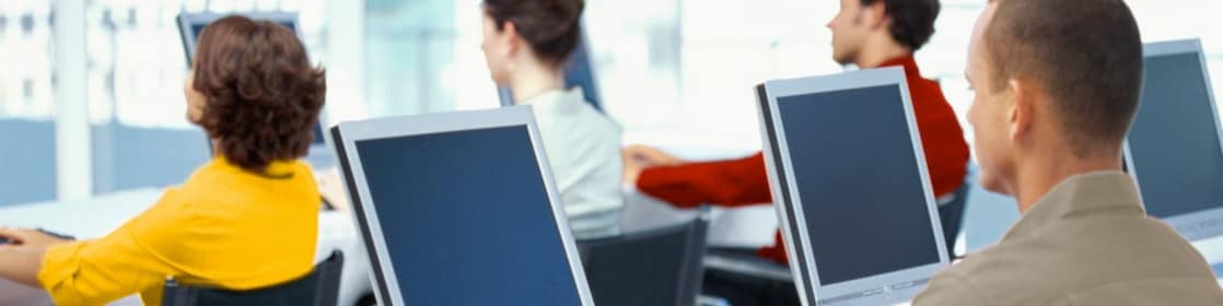Employees using computers in an office