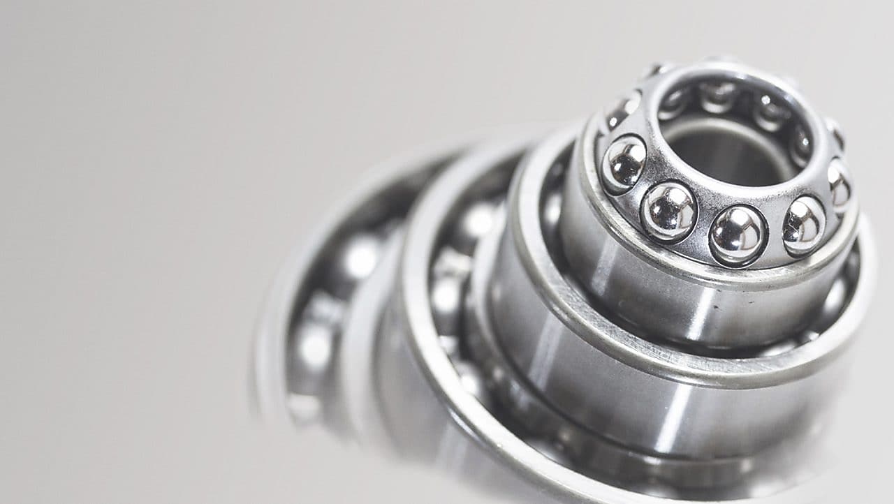 Metal cylinder with ball bearings in