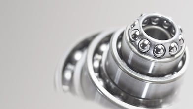 Metal cylinder with ball bearings in