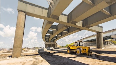 A digger truck at a road flyover construction site