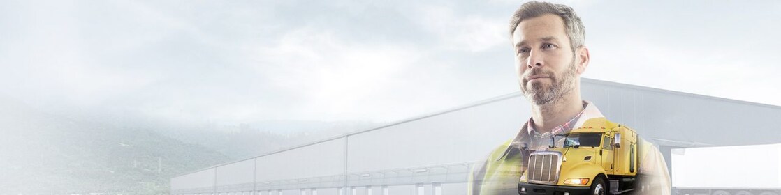 Man reading a document transposed onto a background of a site and yellow truck