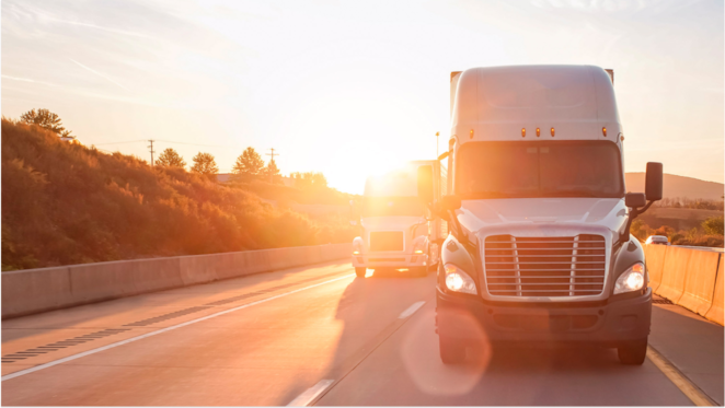 Truck driving in sunset