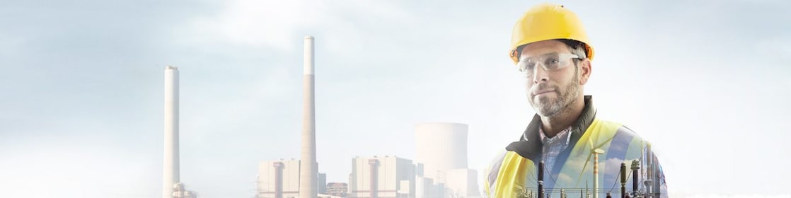 worker in a yellow hard hat transposed onto a background of a power plant