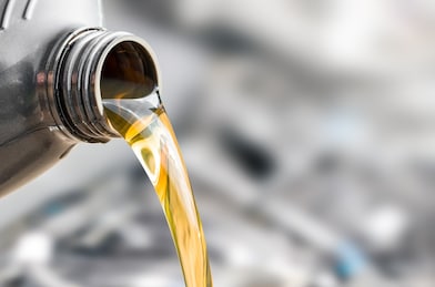 lubricants pouring from a bottle