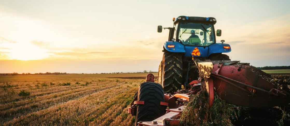 Tractor working in a crop field