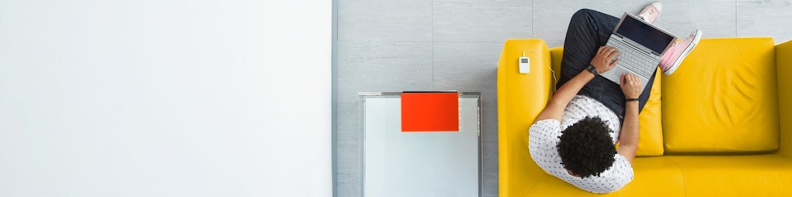 Person relaxing on a sofa in the office