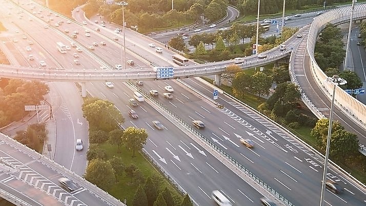Cars driving on a complicated highway infrastructure with over and under passes