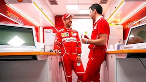 Sebastian Vettel and a Ferrari scientist inside a Shell lab