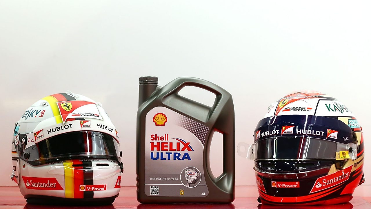 Can of Shell Helix Ultra and two motorcycle helmets