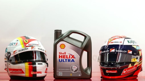 Can of Shell Helix Ultra and two motorcycle helmets