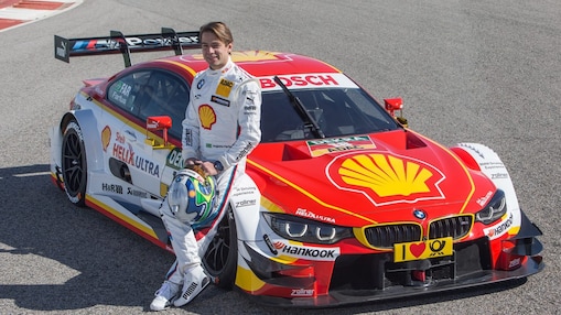BMW motorsport driver leaning on a car which uses a bespoke Shell Helix oil formulation